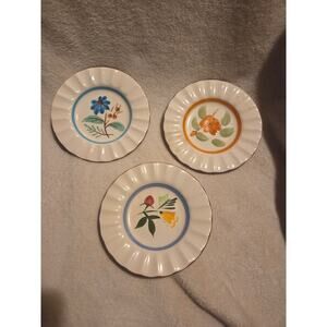 3 stangle bread plates 3 patterns small chips on back see photos
